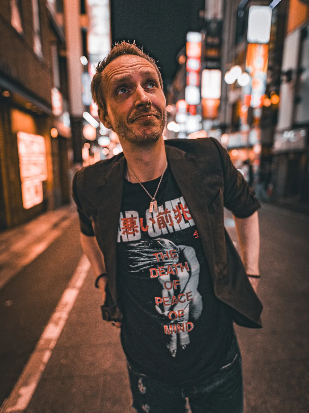 Philip Ask Zeplin-Frederiksen standing in a neon-lit Tokyo street at night.